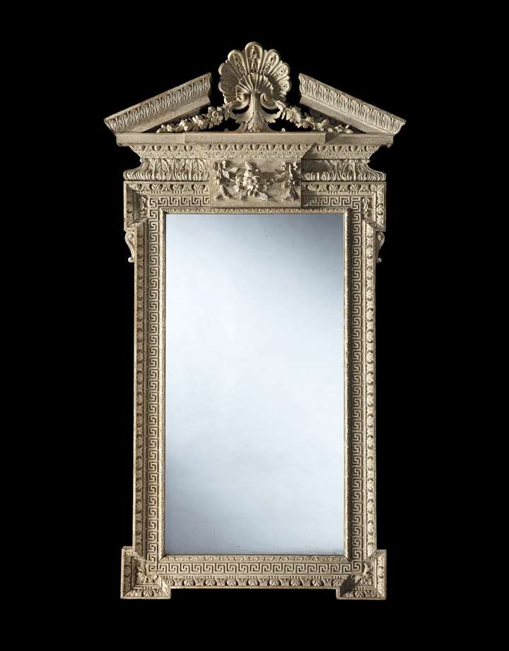 A rare carved mirror retaining its original paint